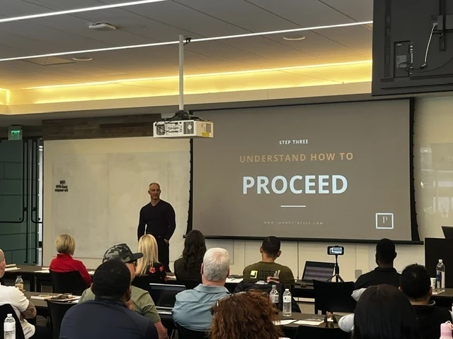 John Petrelli delivering a keynote for a professional audience